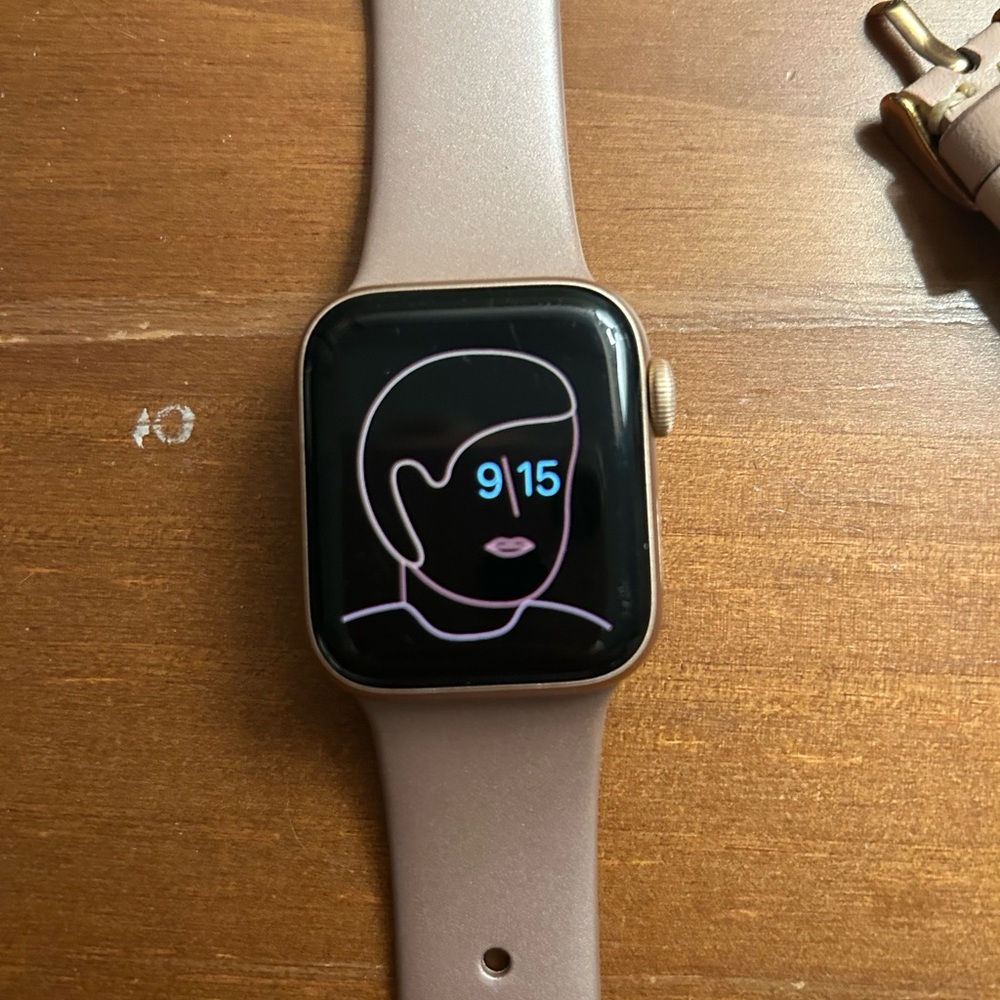 Apple Watch 5 Rose Gold with three bands.